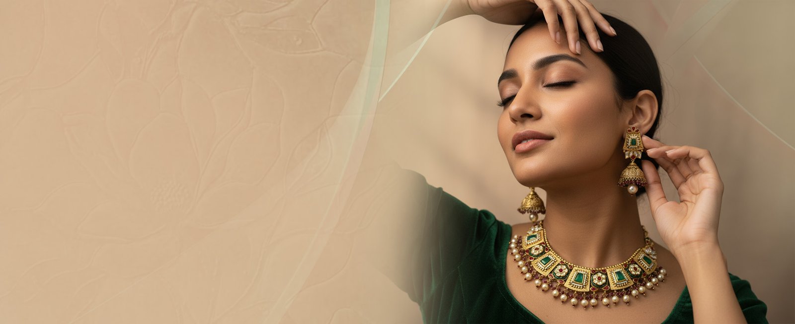 Trending Now - Elegant green jewellery on beige background